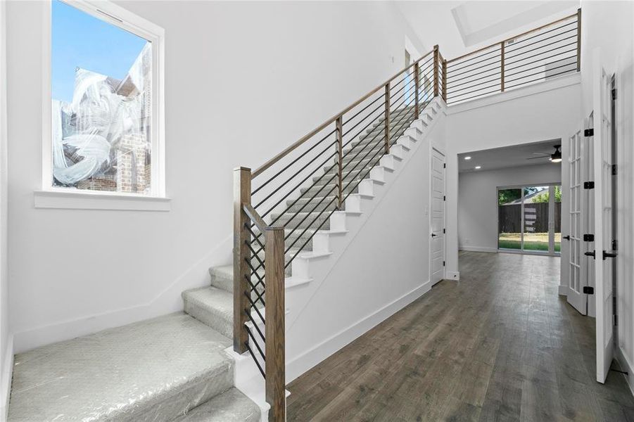 Stairway with wood finished floors and ceiling fan Stairway with wood finished floors and ceiling fan