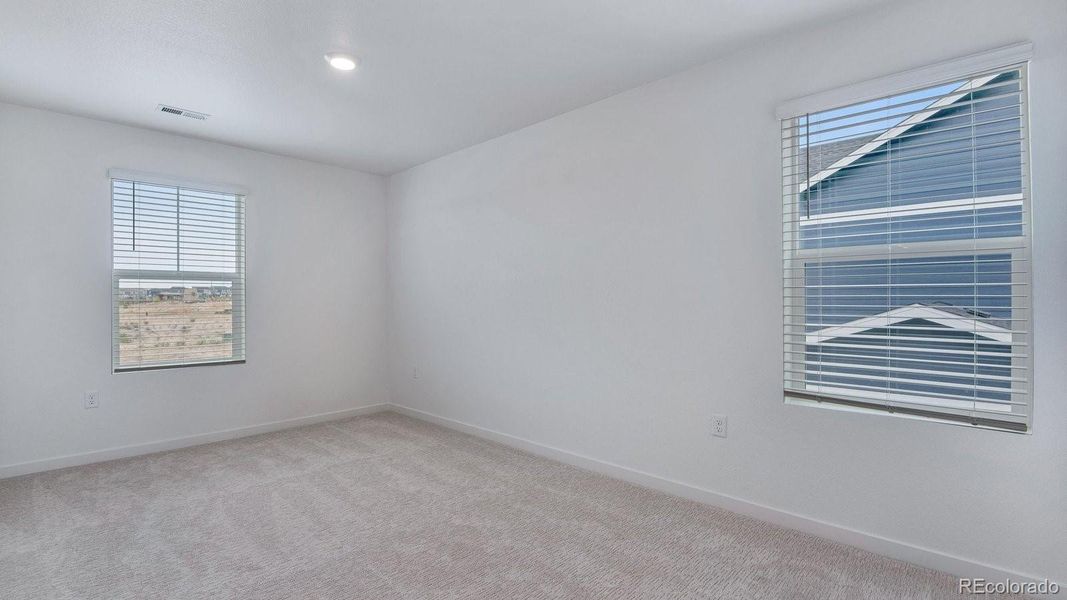 Spacious, unfurnished interior of a new home in Trails at Crowfoot, Parker (Image 29).