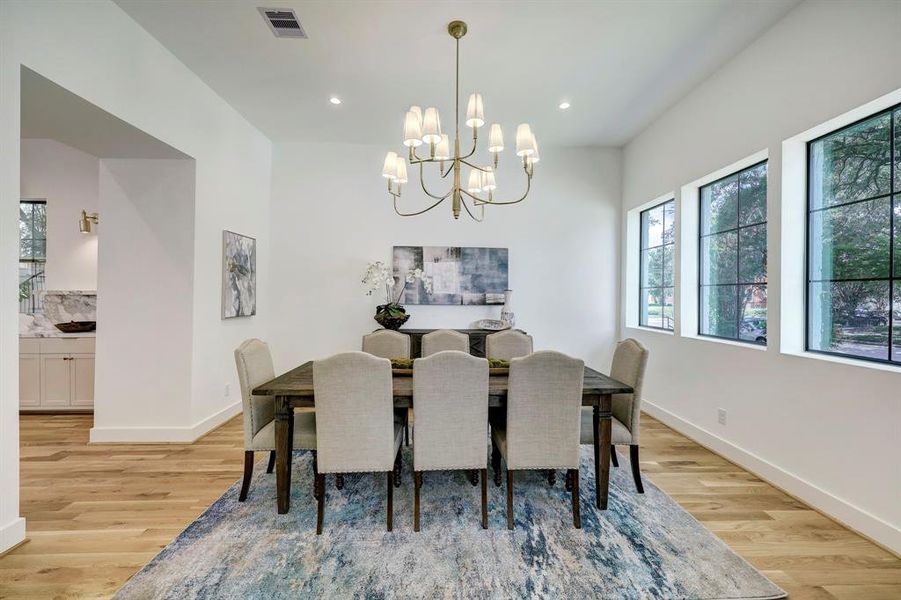 Spacious dining room with abundant natural light and designer finishes