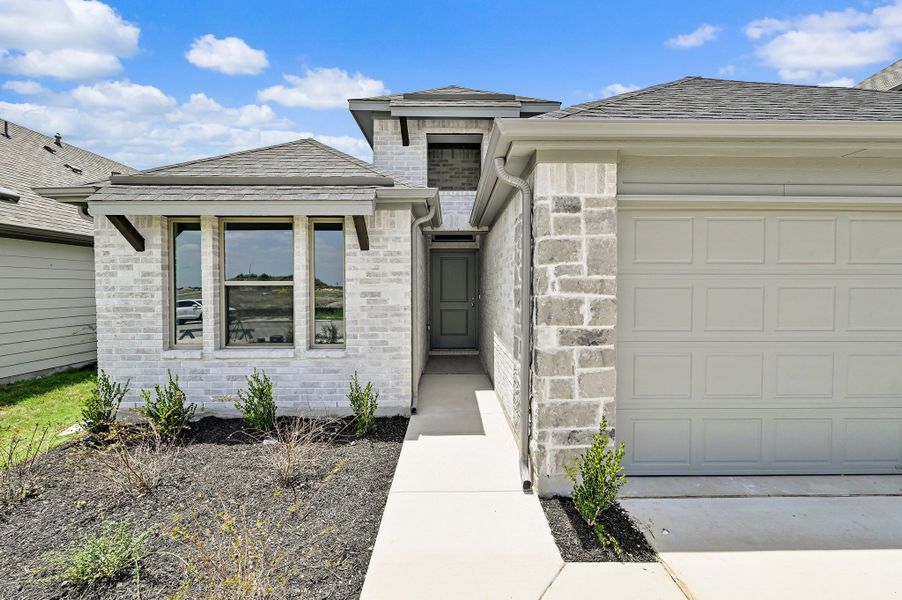 Exterior details and patio area of a home in Prairie Winds, Hutto (Image 3).
