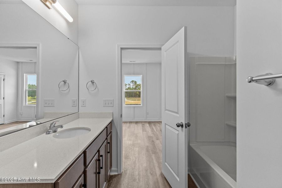 Furnished interior view inside a new home in Coastal Haven Townes, Leland (Image 16).