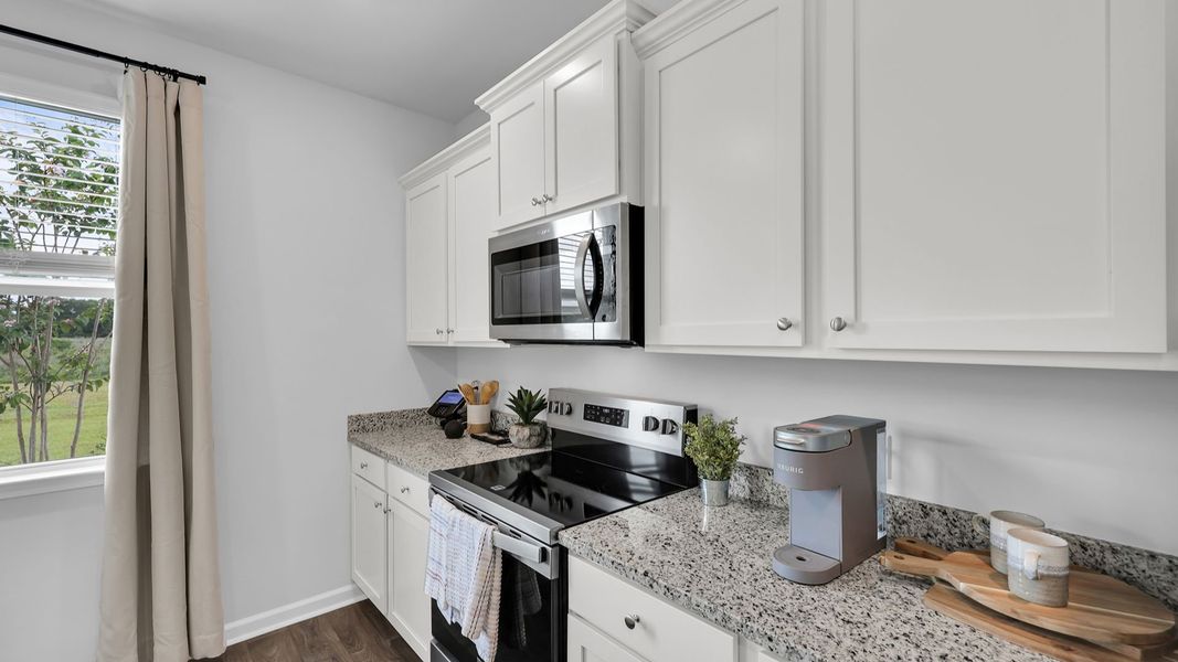 Representative furnished interior of a home built from the BELHAVEN by D.R. Horton in The Ranch, Holly Hill (Image 9). Representative furnished interior of a home built from the BELHAVEN by D.R. Horton in The Ranch, Holly Hill (Image 9).