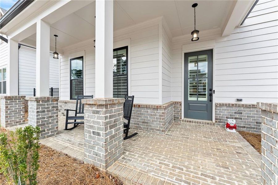 Exterior details and patio area of a home in Promenade at Sawnee Village, Cumming (Image 3).