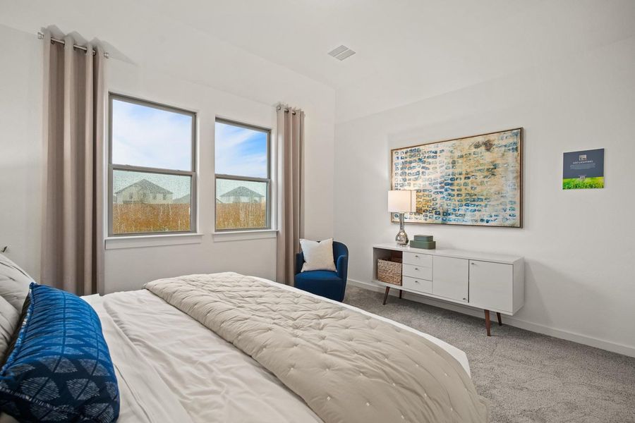 Primary suite in the Oak home plan by Trophy Signature Homes – REPRESENTATIVE PHOTO