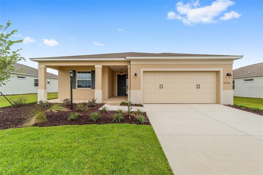Front exterior of a new home in On Top of the World Communities, Ocala, FL, highlighting curb appeal (Image 24).