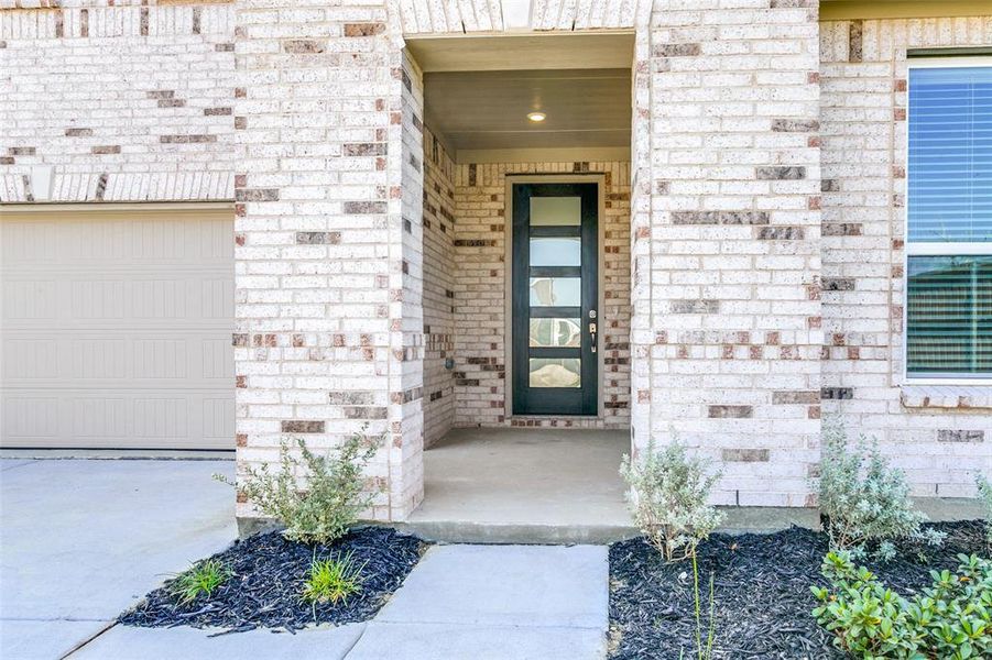 Exterior details and patio area of a home in The Preserve, Justin (Image 22).