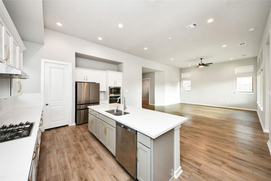 Spacious kitchen featuring oversized island and open living flow