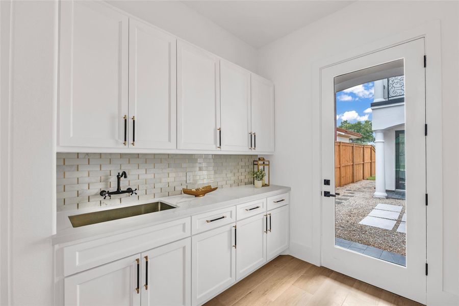 Private entry into the casita features a wet bar with a cozy sitting area directly across—ideal for guests or extended stays.