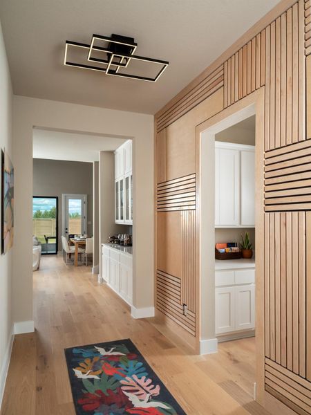 Hall featuring light wood-type flooring