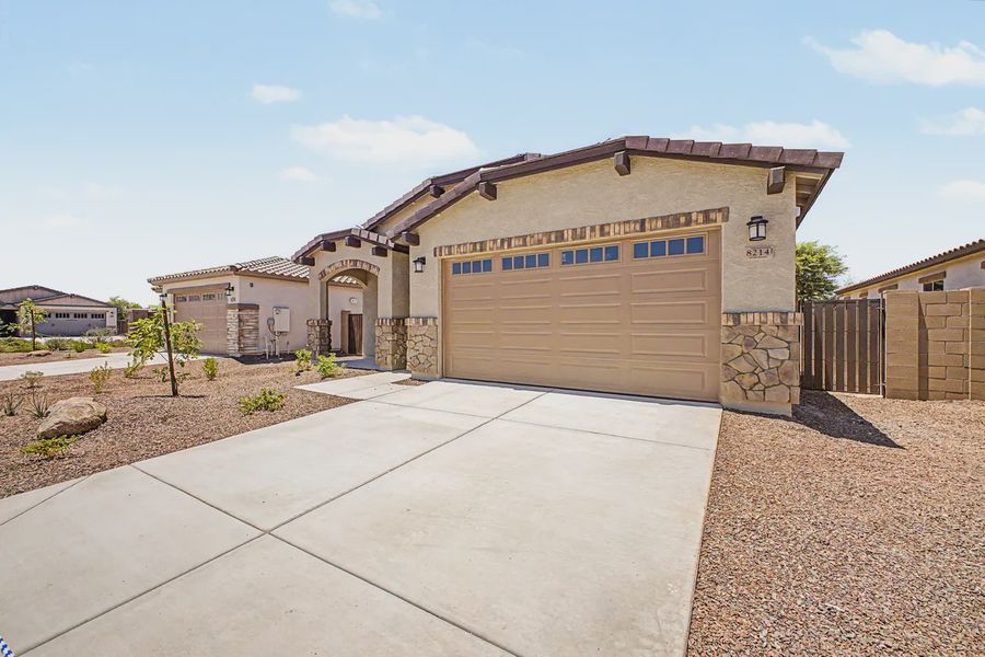 Front exterior of a new home in Avanti at Granite Vista, Waddell, AZ, highlighting curb appeal (Image 2). Front exterior of a new home in Avanti at Granite Vista, Waddell, AZ, highlighting curb appeal (Image 2).