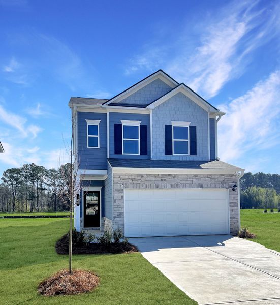 Front exterior of a new home in The Andros, Dalton, GA, highlighting curb appeal (Image 1). Front exterior of a new home in The Andros, Dalton, GA, highlighting curb appeal (Image 1).