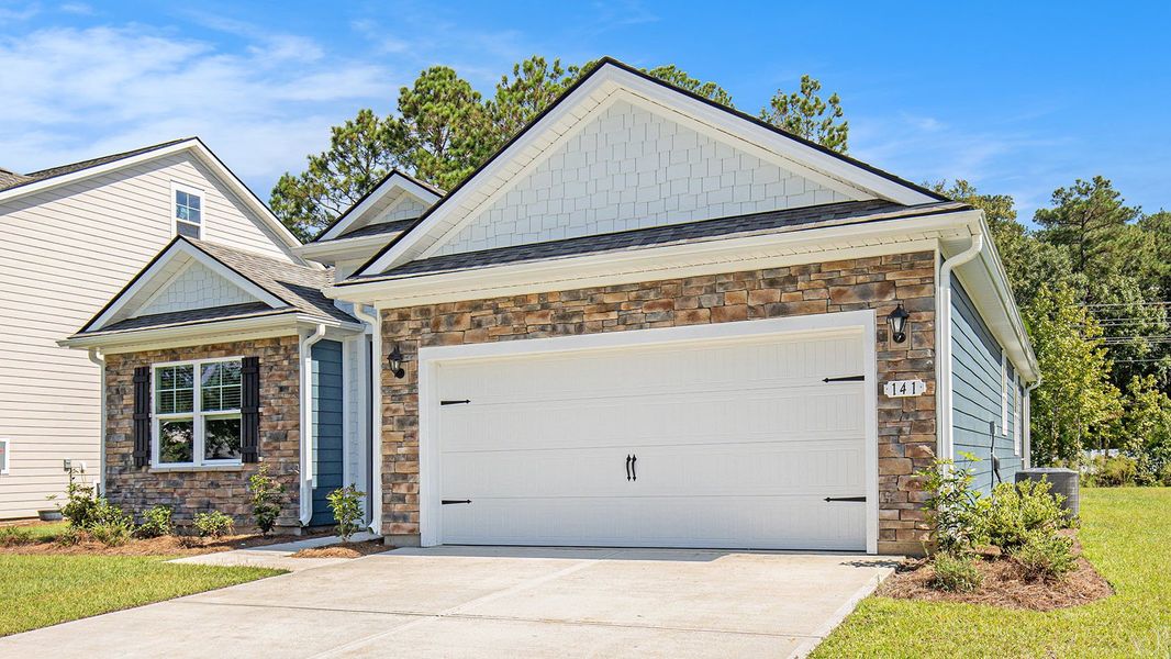 Front exterior of a new home in The Bluffs at Mill Creek, Florence, SC, highlighting curb appeal (Image 15).