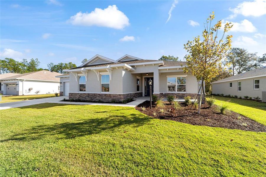 Front exterior of a new home in , Ocala, FL, highlighting curb appeal (Image 1). Front exterior of a new home in , Ocala, FL, highlighting curb appeal (Image 1).