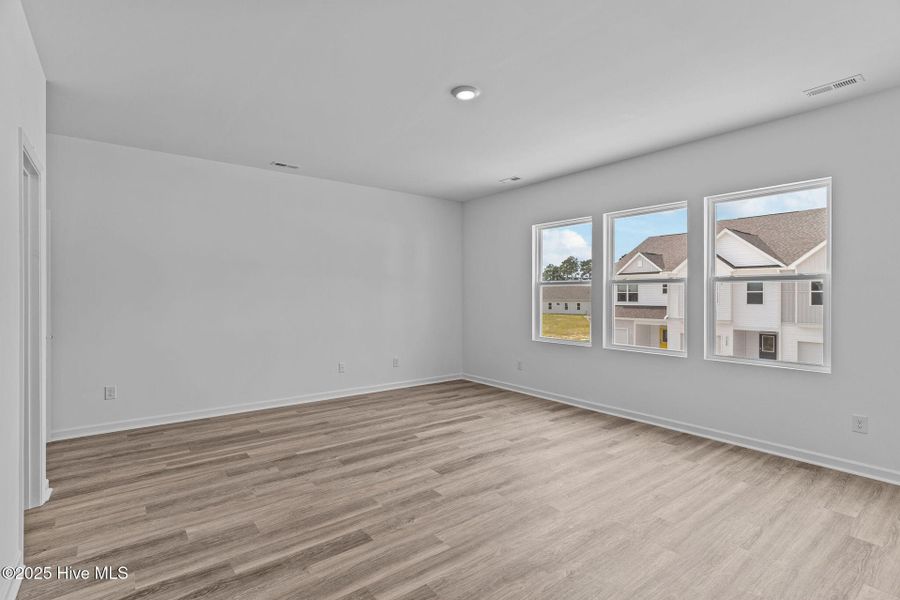 Spacious, unfurnished interior of a new home in Coastal Haven Townes, Leland (Image 24).
