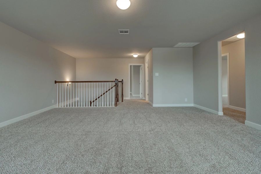 Representative unfurnished interior of a home built from the Cleburne by Ashton Woods in Mustang Oaks, San Antonio (Image 36).