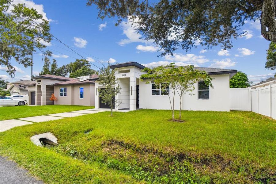 Front exterior of a new home in , Tampa, FL, highlighting curb appeal (Image 35).