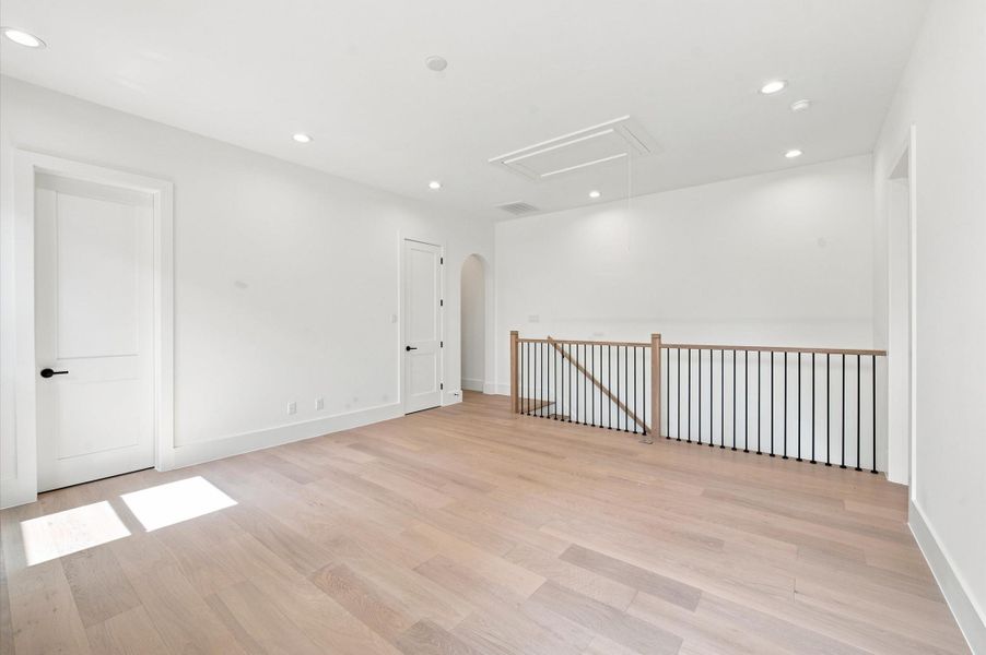 Spacious game room with a walk-in closet and direct access to a full bathroom.