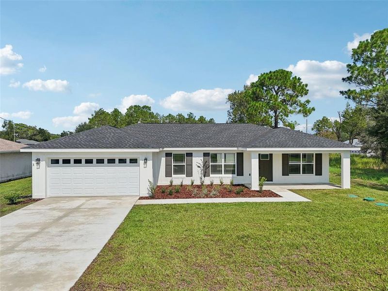 Front exterior of a new home in , Ocala, FL, highlighting curb appeal (Image 1).
