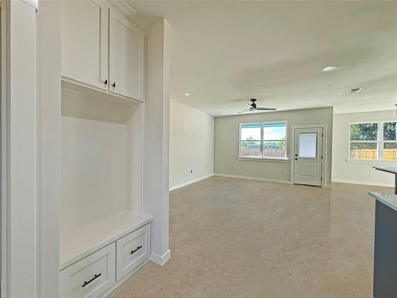 Built in storage space with recessed lighting and ceiling fan