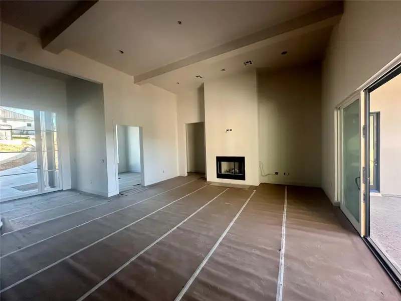 Unfurnished living room featuring a fireplace Unfurnished living room featuring a fireplace