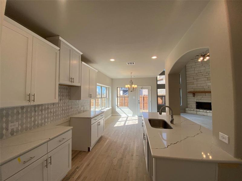 White shaker style cabinets have Nickel hardware and soft closing drawers & doors.