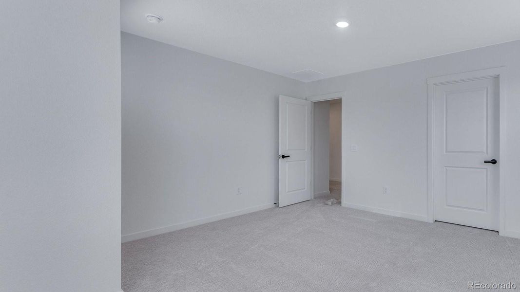 Spacious, unfurnished interior of a new home in Trails at Crowfoot, Parker (Image 19).