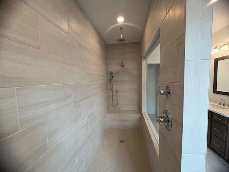 primary bathroom with rain head and bench primary bathroom with rain head and bench