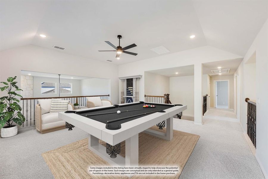Upstairs game room with pool table, ceiling fan, seating area, and open railing overlooking lower level Upstairs game room with pool table, ceiling fan, seating area, and open railing overlooking lower level