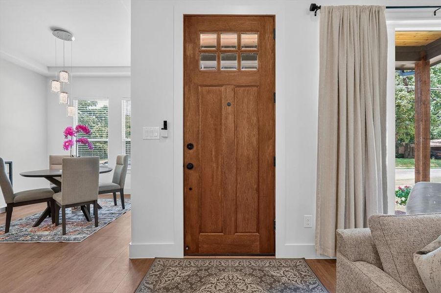 Solid wood entry door with upper window panes