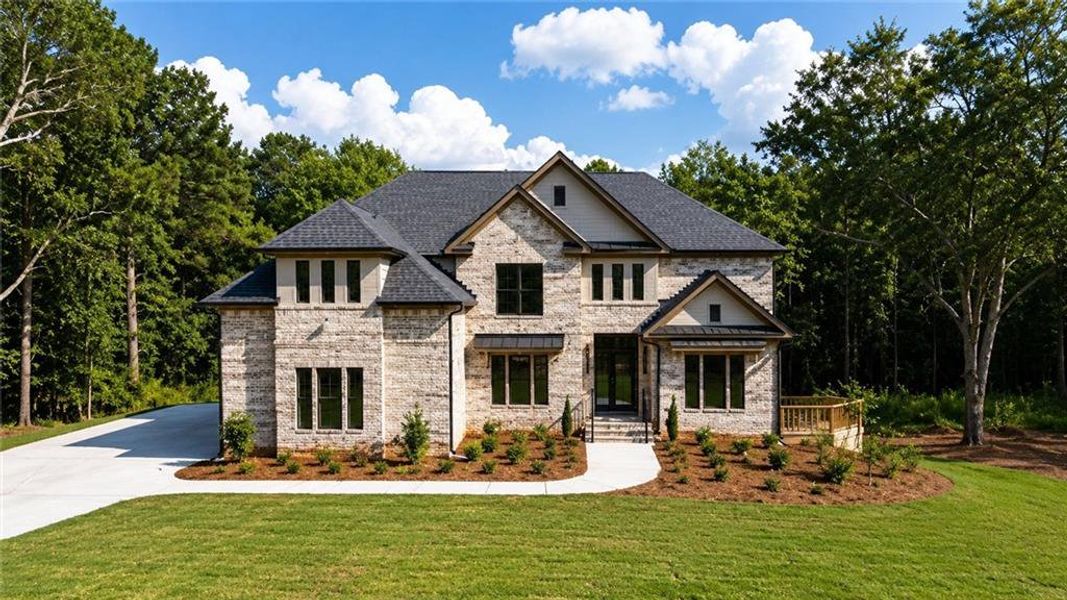 Front exterior of a new home in , Loganville, GA, highlighting curb appeal (Image 24).