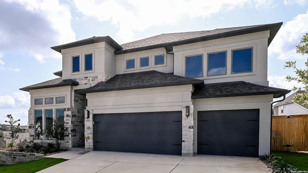 Front exterior of a new home in Johnson Ranch, Bulverde, TX, highlighting curb appeal (Image 2).