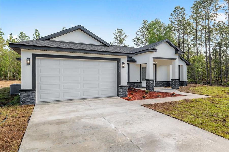 Front exterior of a new home in , Dunnellon, FL, highlighting curb appeal (Image 32).
