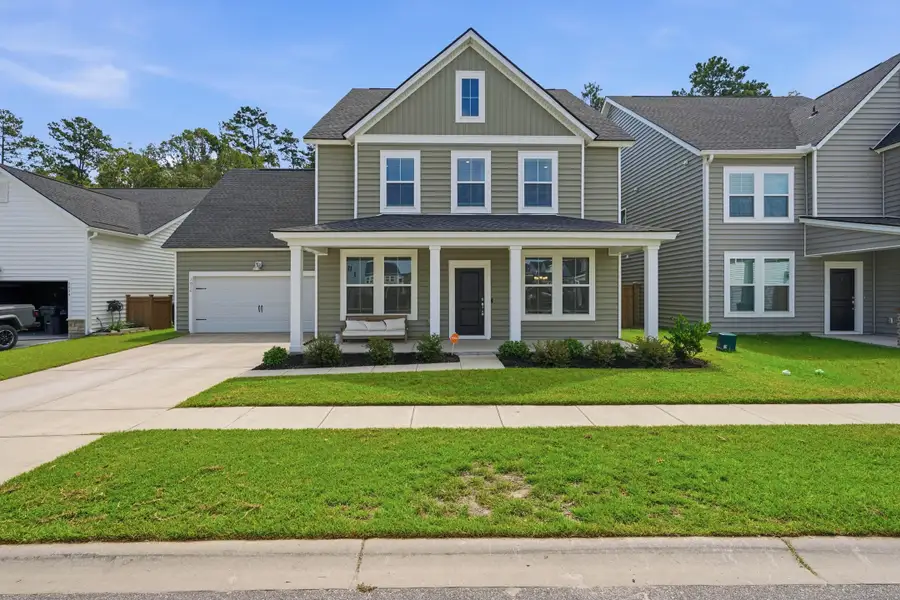 Front exterior of a new home in Sweetgrass at Summers Corner, Summerville, SC, highlighting curb appeal (Image 29). Front exterior of a new home in Sweetgrass at Summers Corner, Summerville, SC, highlighting curb appeal (Image 29).