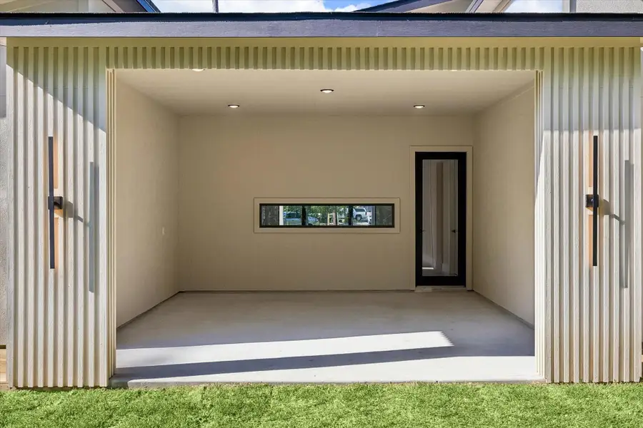 Exterior details and patio area of a home in , Conroe (Image 3).