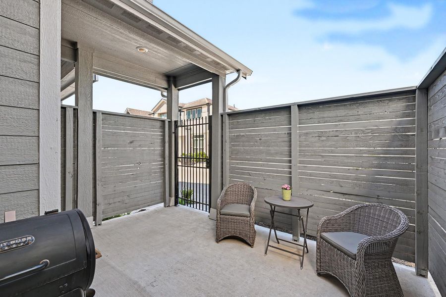 A lovely enclosed front patio offers the perfect setting for intimate gatherings with added privacy. A lovely enclosed front patio offers the perfect setting for intimate gatherings with added privacy.