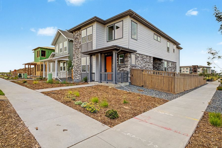 Front exterior of a new home in Painted Prairie, Aurora, CO, highlighting curb appeal (Image 12).