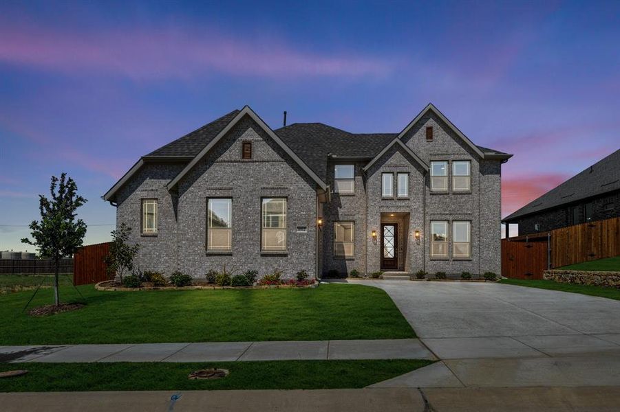 Front exterior of a new home in Country Lakes, Denton, TX, highlighting curb appeal (Image 2).