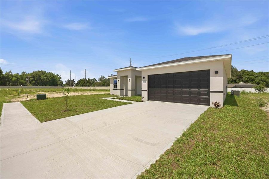 Front exterior of a new home in , Winter Haven, FL, highlighting curb appeal (Image 22).
