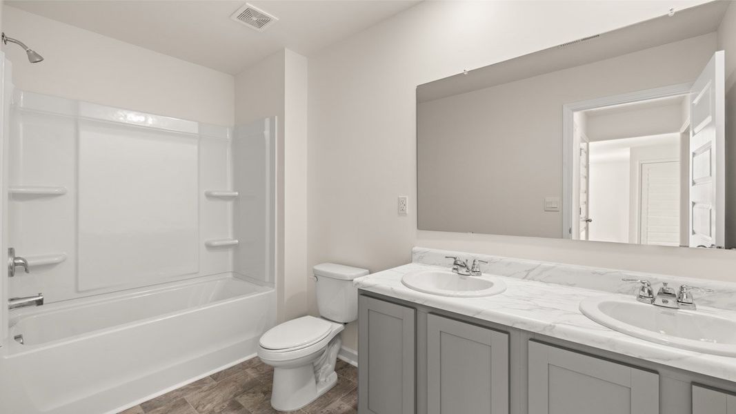 Representative furnished interior of a home built from the Belfort by D.R. Horton in Locust Grove Station - Cedar Ridge, Locust Grove (Image 10).