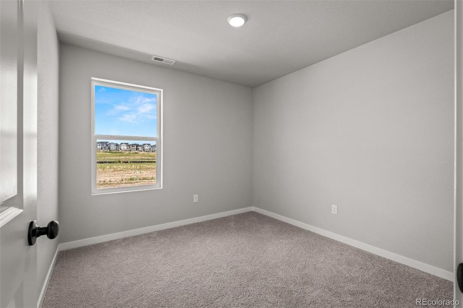 Spacious, unfurnished interior of a new home in Revel Crossing at Wolf Ranch – The Ascent Collection, Colorado Springs (Image 26).