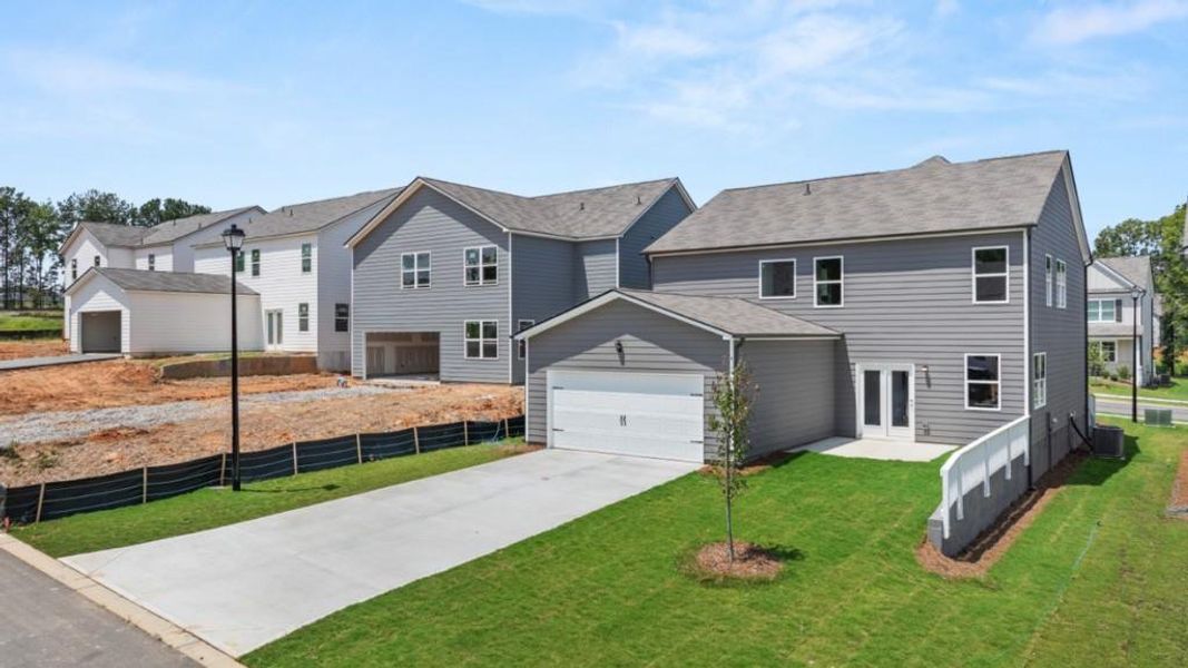 Front exterior of a new home in Braselton Village, Braselton, GA, highlighting curb appeal (Image 19). Front exterior of a new home in Braselton Village, Braselton, GA, highlighting curb appeal (Image 19).