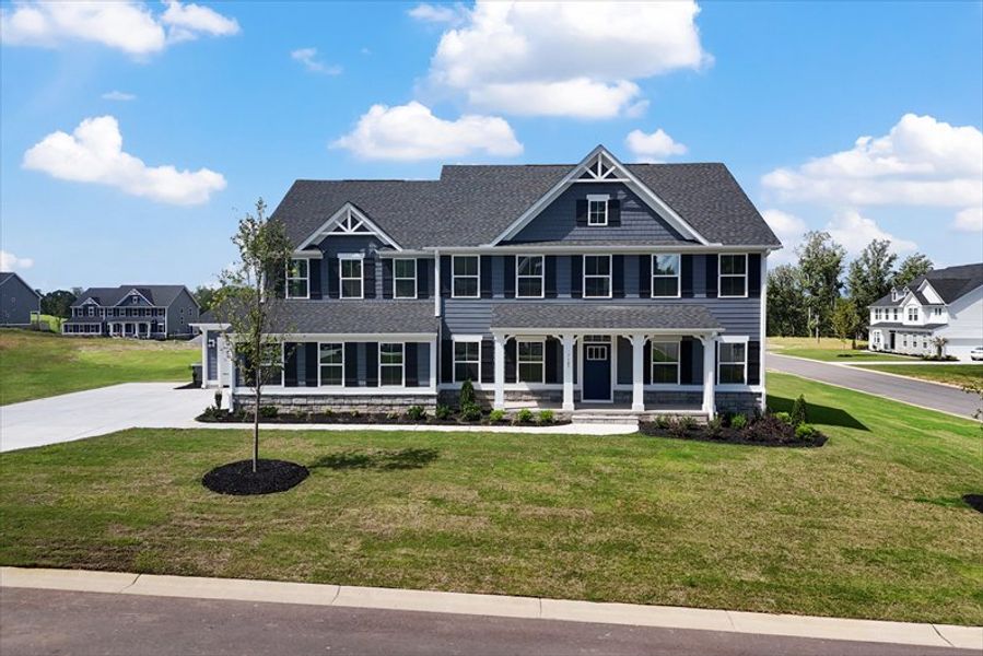 Front exterior of a new home in Everly Estates, Spartanburg, SC, highlighting curb appeal (Image 2). Front exterior of a new home in Everly Estates, Spartanburg, SC, highlighting curb appeal (Image 2).