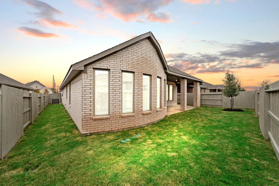 Exterior details and patio area of a home in Pomona 50' & 55', Manvel (Image 4).
