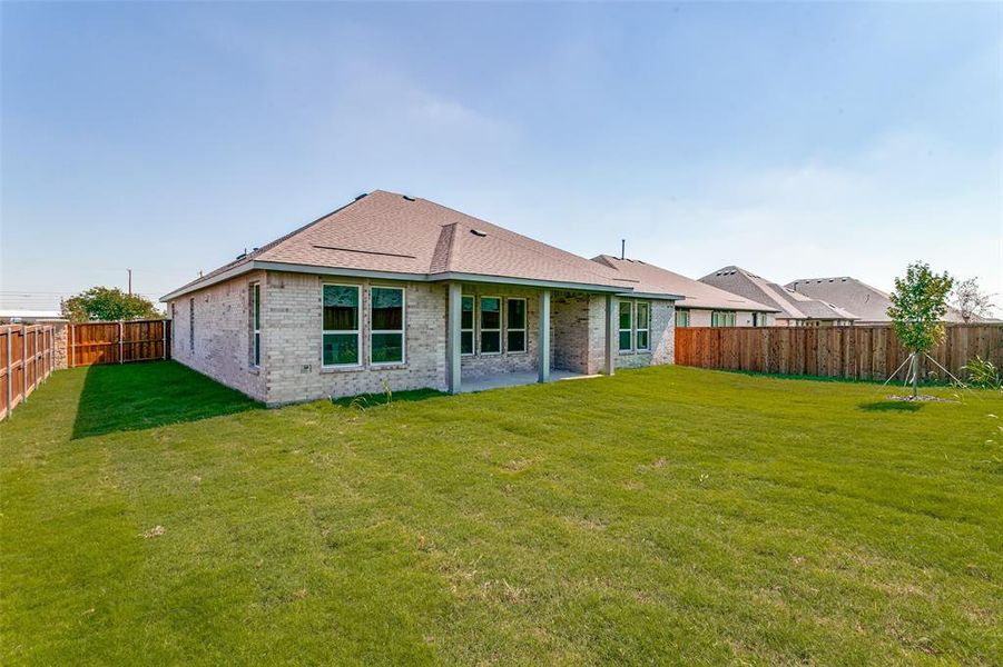 Exterior details and patio area of a home in The Preserve Estates, Justin (Image 4).
