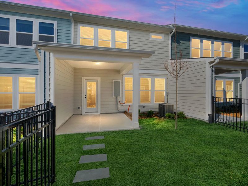 Exterior details and patio area of a home in North Creek Village - Townhomes, Huntersville (Image 3).