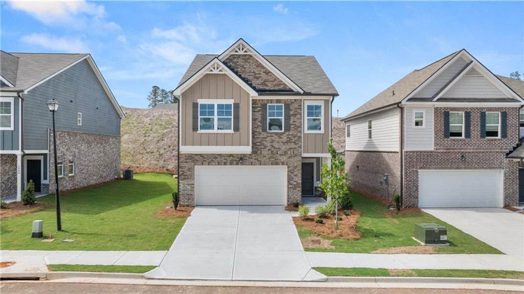 Front exterior of a new home in Alcovy Village, Lawrenceville, GA, highlighting curb appeal (Image 1).