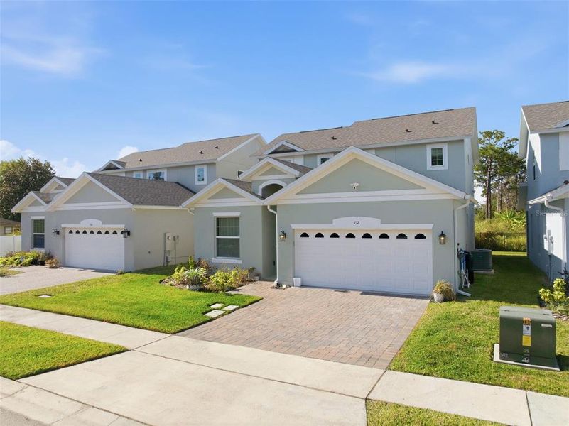 Front exterior of a new home in Blue Diamond , Orlando, FL, highlighting curb appeal (Image 2). Front exterior of a new home in Blue Diamond , Orlando, FL, highlighting curb appeal (Image 2).