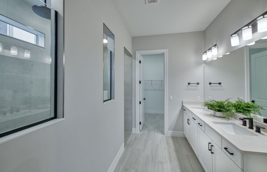Representative furnished interior of a home built from the Millstone by DiVosta in Avondale at Avenir, Palm Beach Gardens (Image 22).