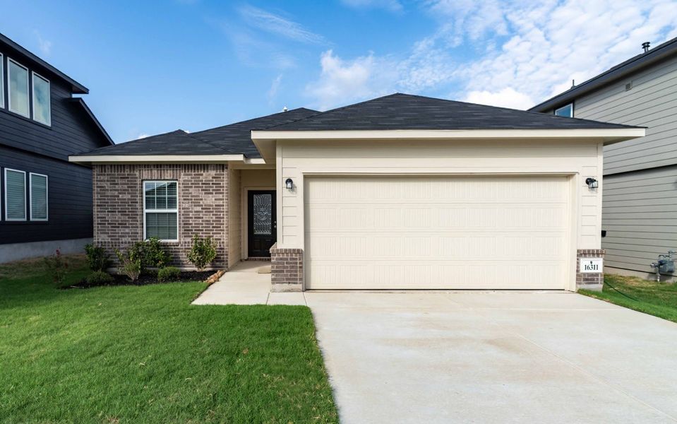 Front exterior of a new home in Hickory Ridge, Elmendorf, TX, highlighting curb appeal (Image 1). Front exterior of a new home in Hickory Ridge, Elmendorf, TX, highlighting curb appeal (Image 1).