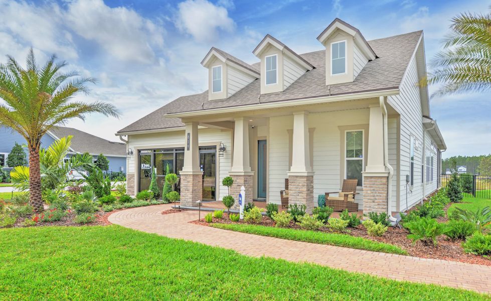 Front exterior of a new home in Middlebourne, St. Johns, FL, highlighting curb appeal (Image 16). Front exterior of a new home in Middlebourne, St. Johns, FL, highlighting curb appeal (Image 16).